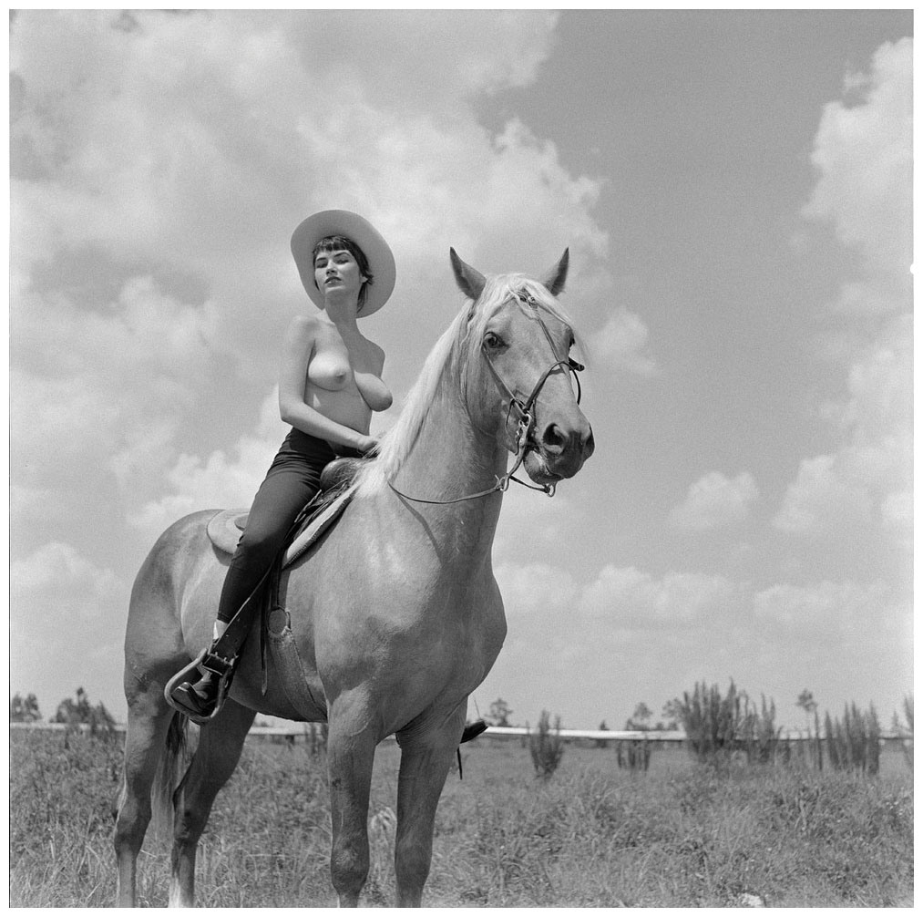Bunny Yeager topless on horse film photo