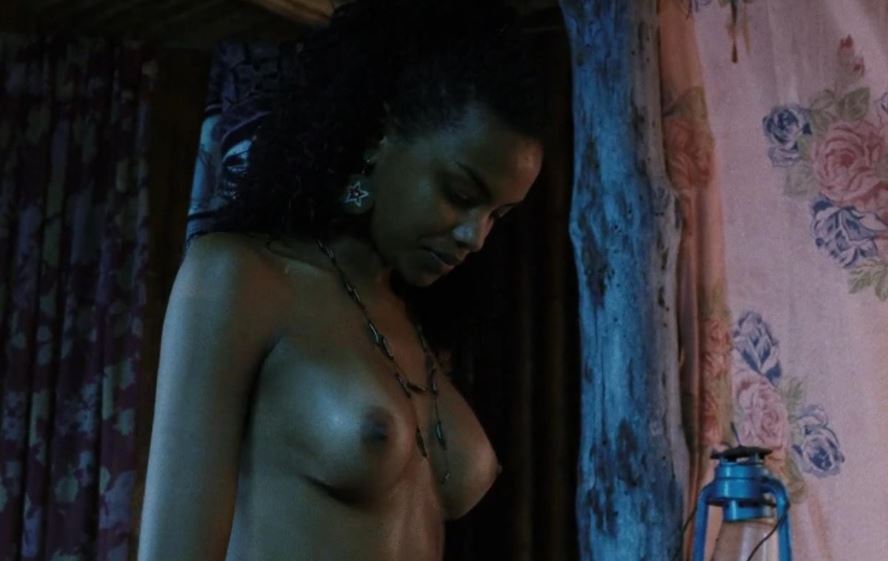 Lucy Ramones her topless round boobies in Turistas in naughty striptease scene movie still 1
