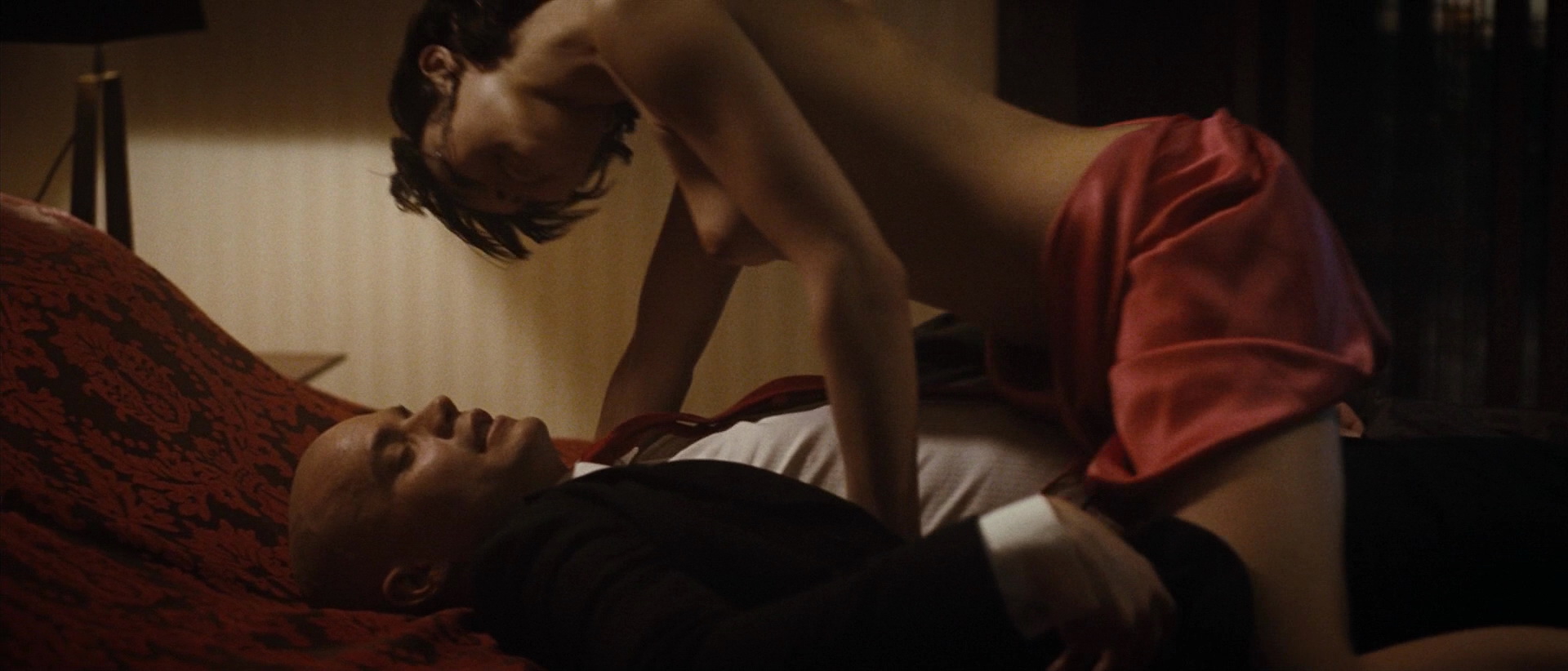 naughty, horny, topless and lovely sexy Olga Kurylenko climbs on top of a lucky guy and seduces him for some steaming hot and naughty adventures! Lucky bastard...
