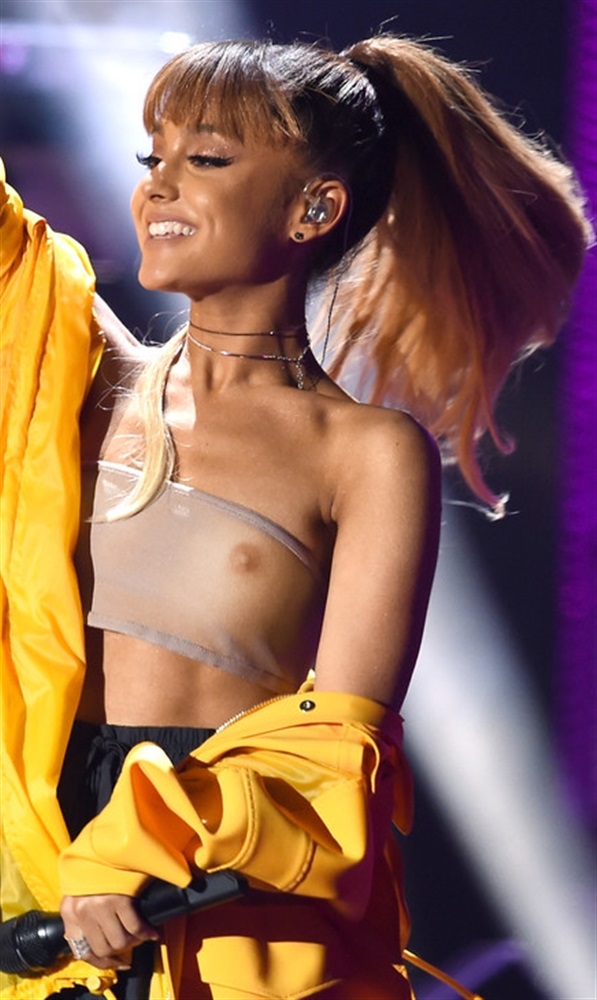 Sexy teen celeb Ariana Grande see through clothes at a concert. Showing her tits and nipples!