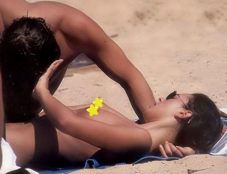 Topless Monica Bellucci and her partner paparazzi beach candid. Great celeb titties!