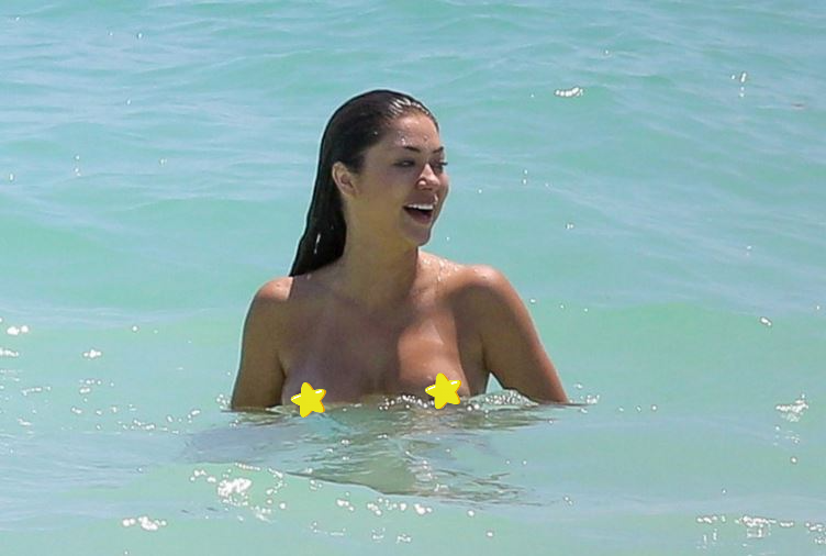UFC ring babe Arianny Celeste has been seen topless skinny dipping in the beach water