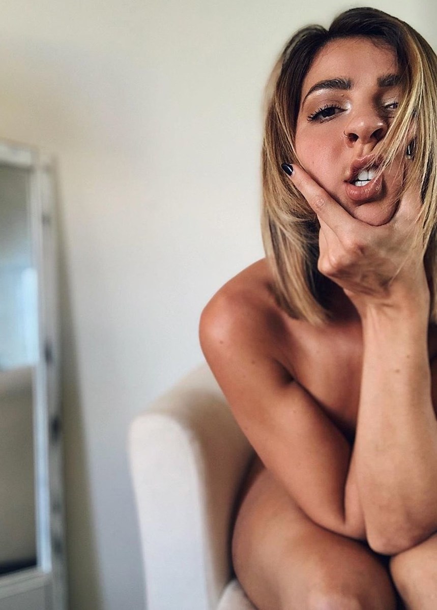 Ready to enjoy the 28 year old Gabbie Hanna while she strips nude? 