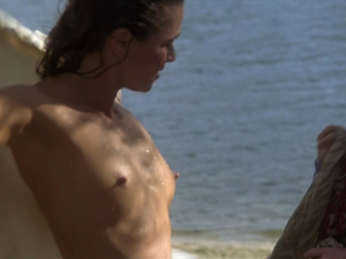 Julie Warner tits topless at the beach.