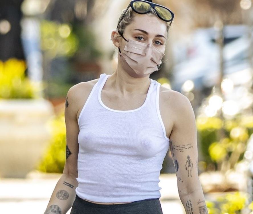 Miley Cyrus braless in public with see-thru nipples in white top (2022)