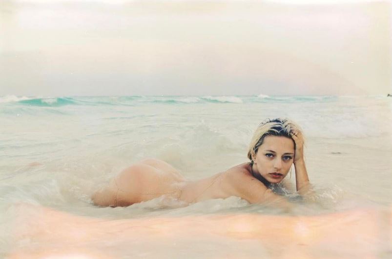 The hot and sexy blonde singer / songwriter Caroline Vreeland and her sweet tight little naked ass exposed while swimming (skinny dipping) outdoors